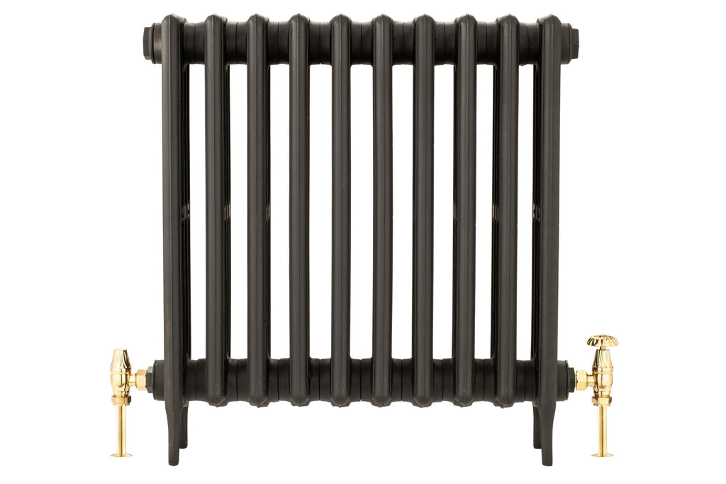 Florence Manual Radiator Valve Set in brass, fitted to black radiator